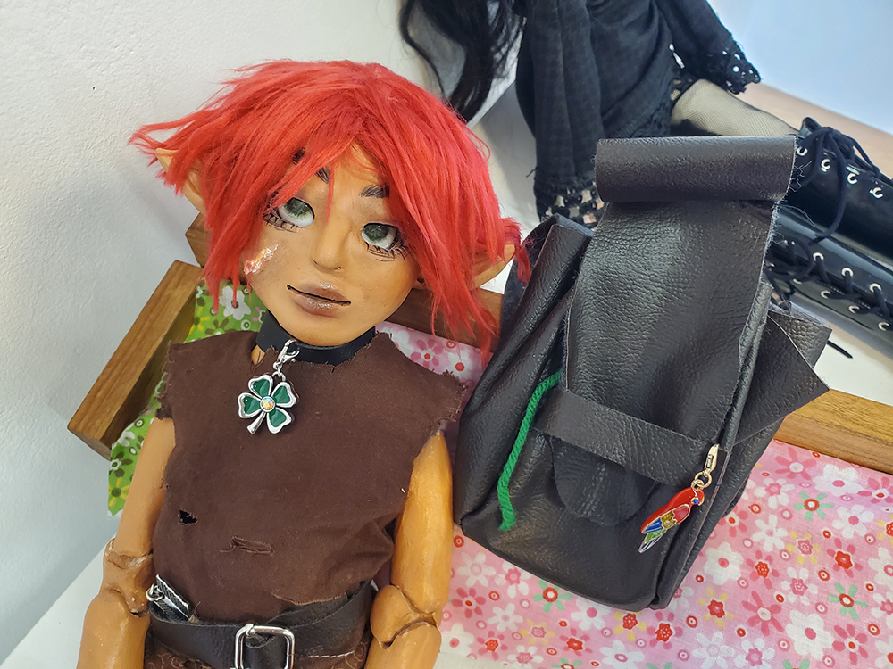 The elven doll seen with a pouch.