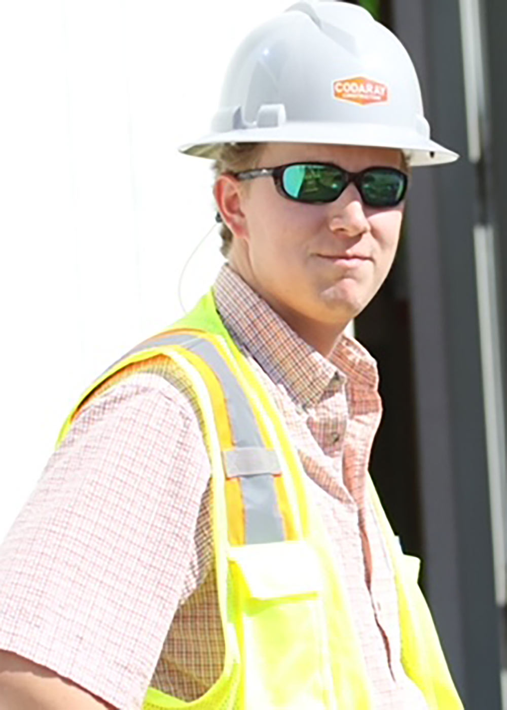 Ryan Ables poses wearing construction PPE
