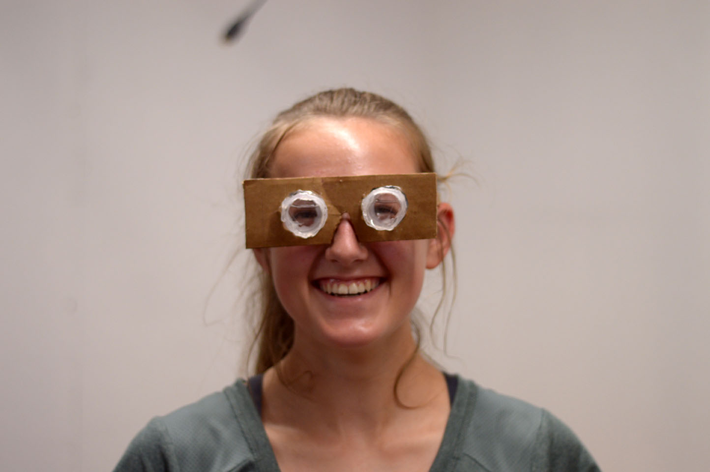 Female student trying on perception unit glasses