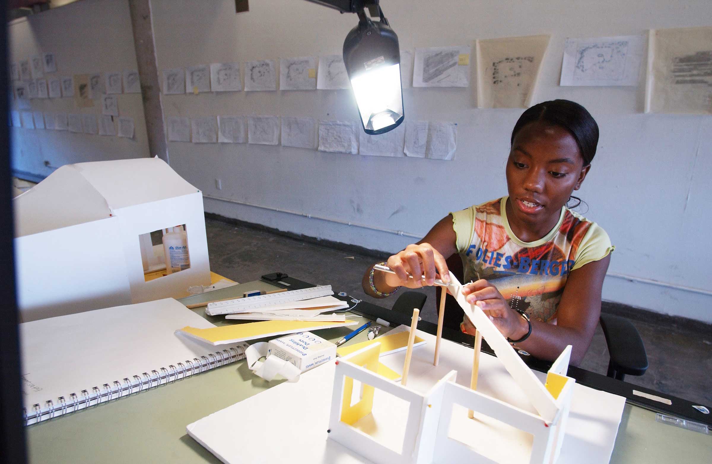 architecture student at her studio in Giles Hall