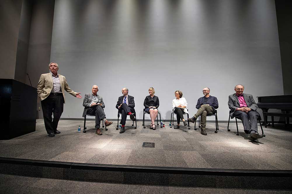 Former CAAD Dean Jim West, standing, introduces a panel of former faculty and administrators of the university’s Fred Carl Jr. Small Town Center. Panelists (seated, l-r) include John McRae, John Poros, Kimberly Brown, Shannon Criss, Nils Gore, and Michael Buono.