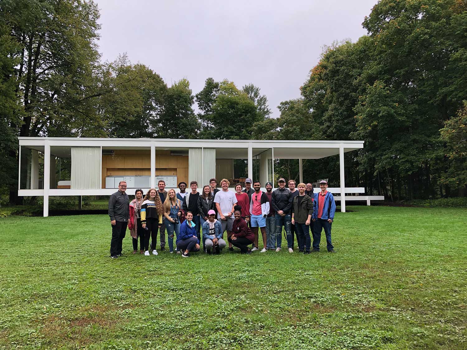 Mississippi State University third-year architecture students at the Farnsworth House designed by Mies van der Rohe.