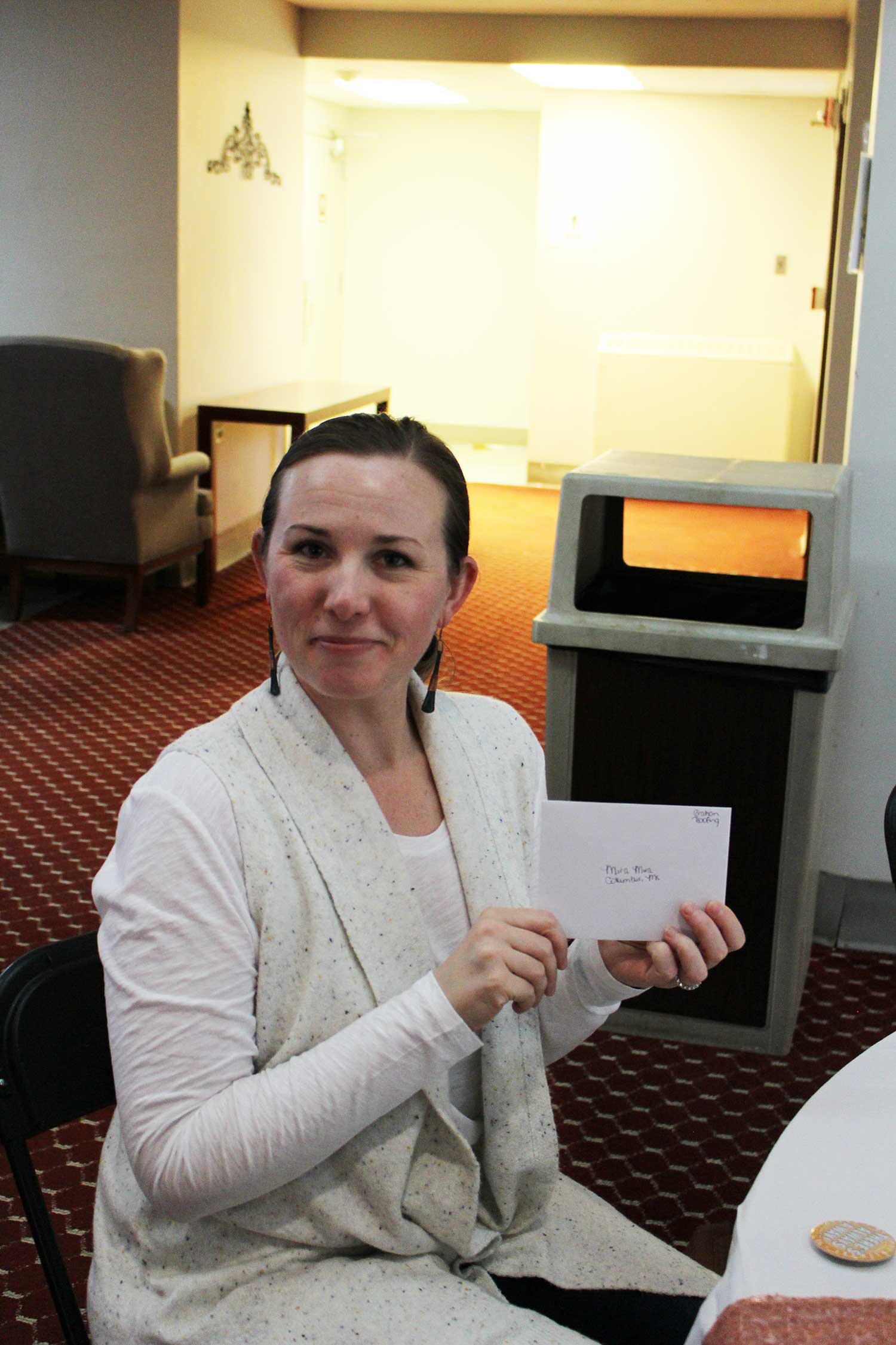 Michele Herrmann displays gift card envelope