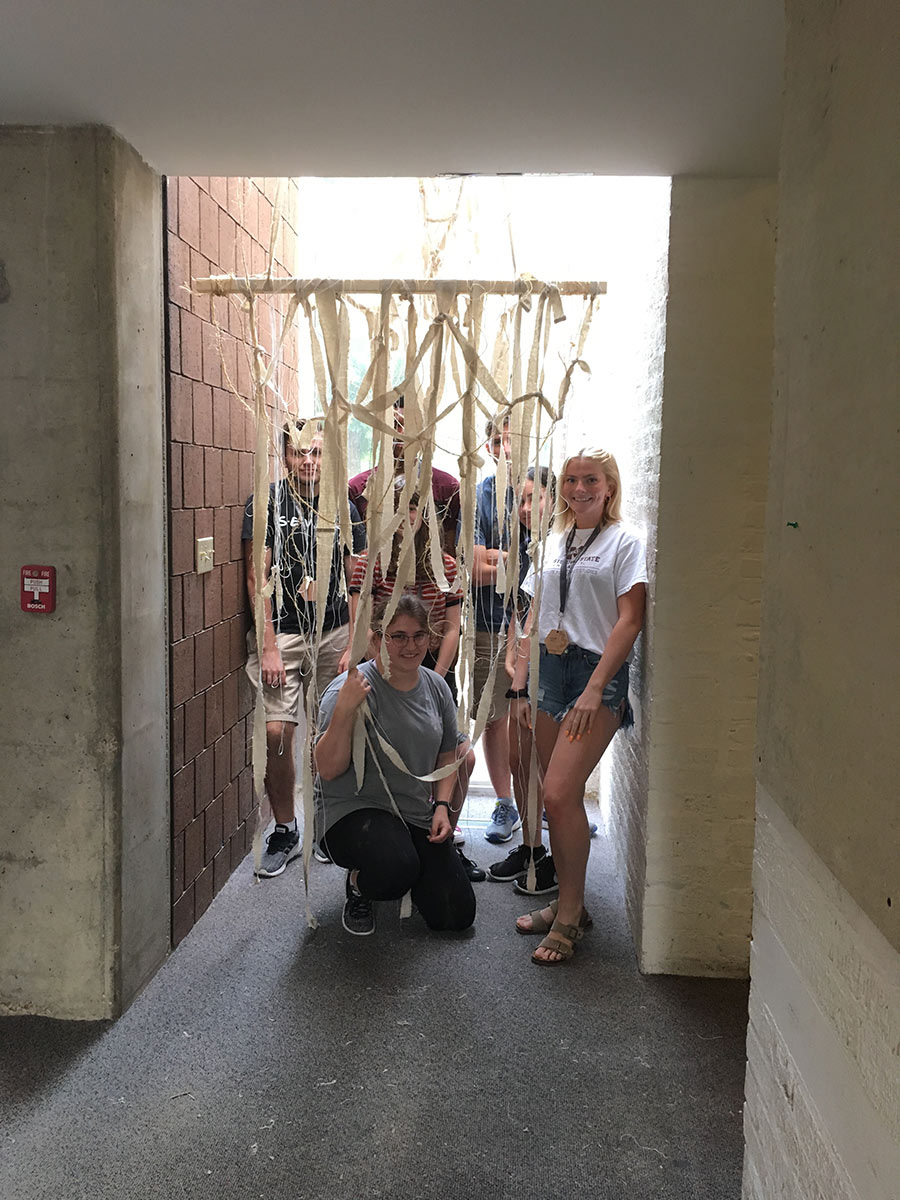 group of Design Discovery campers pose in Giles Hall with their instant environment