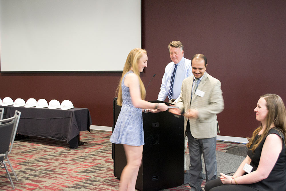 Saeed Rokooei presents second-year student of the year award to Tori Thompson