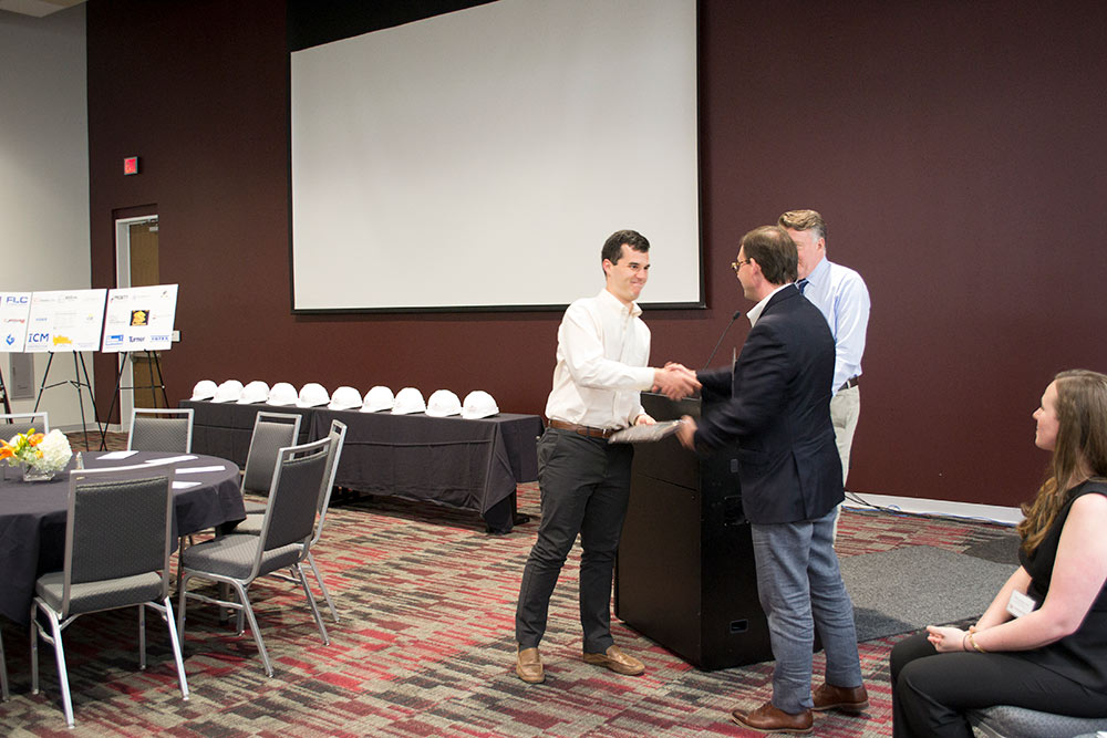Briar Jones presents third-year student of the year award to Evan Hodge