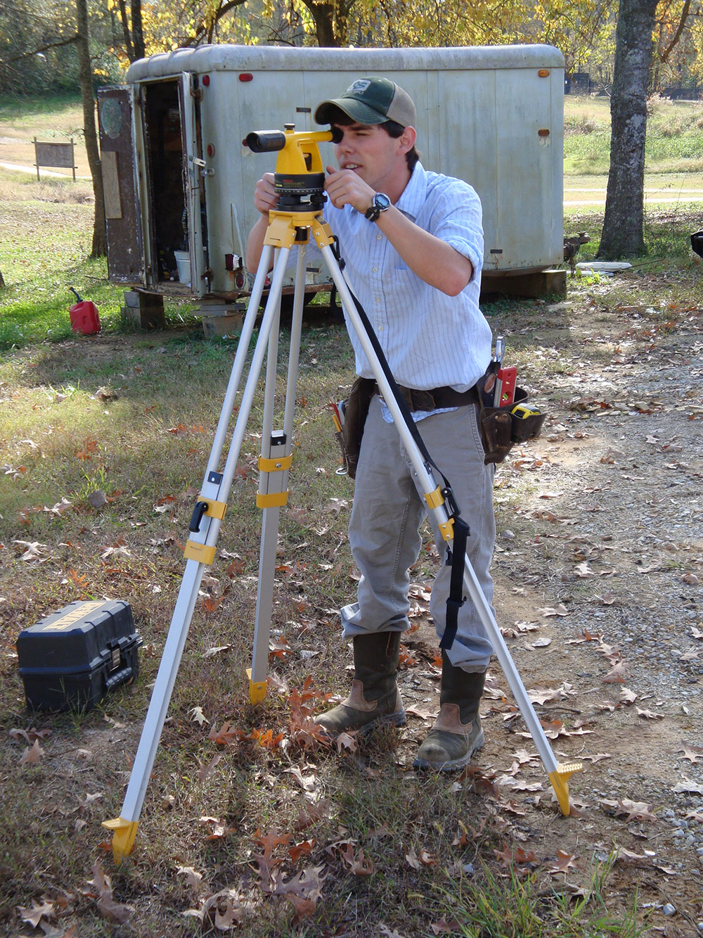 student using surveying equipment