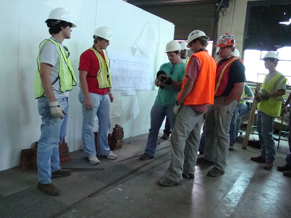 group gathered working on construction project