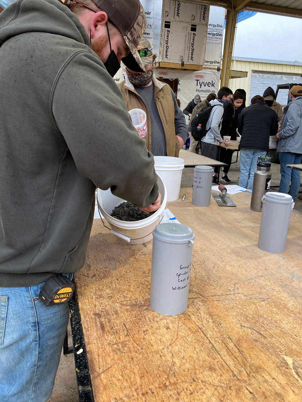 students mixing concrete
