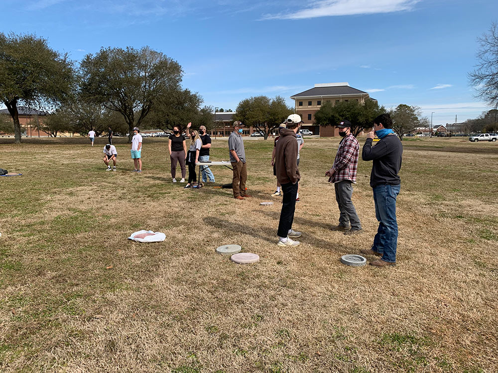 students in field to test concrete disks