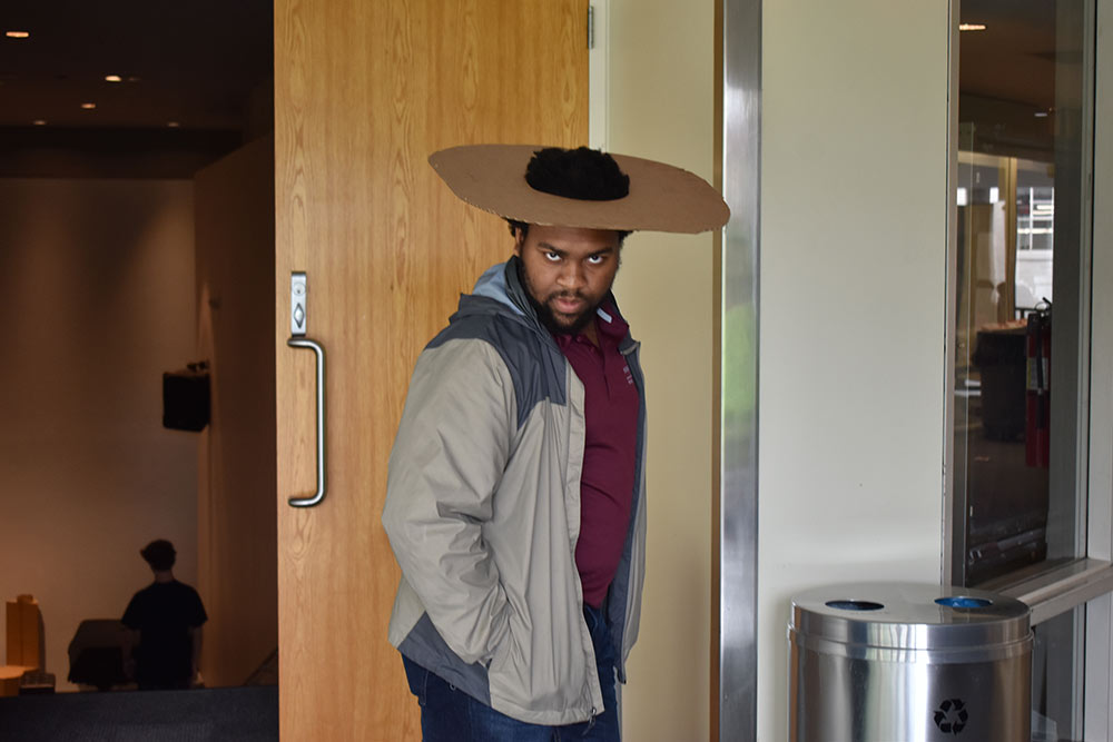 counselor Terrance Blackmon poses for photo with cardboard hat