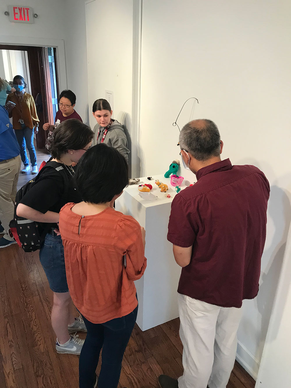 visitors view campers&#039; work on display in the Visual Arts Center Gallery