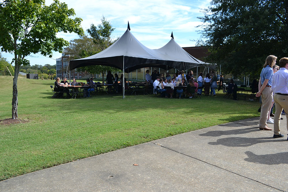 Tent set up outside of Giles with tables for participants to sit at.