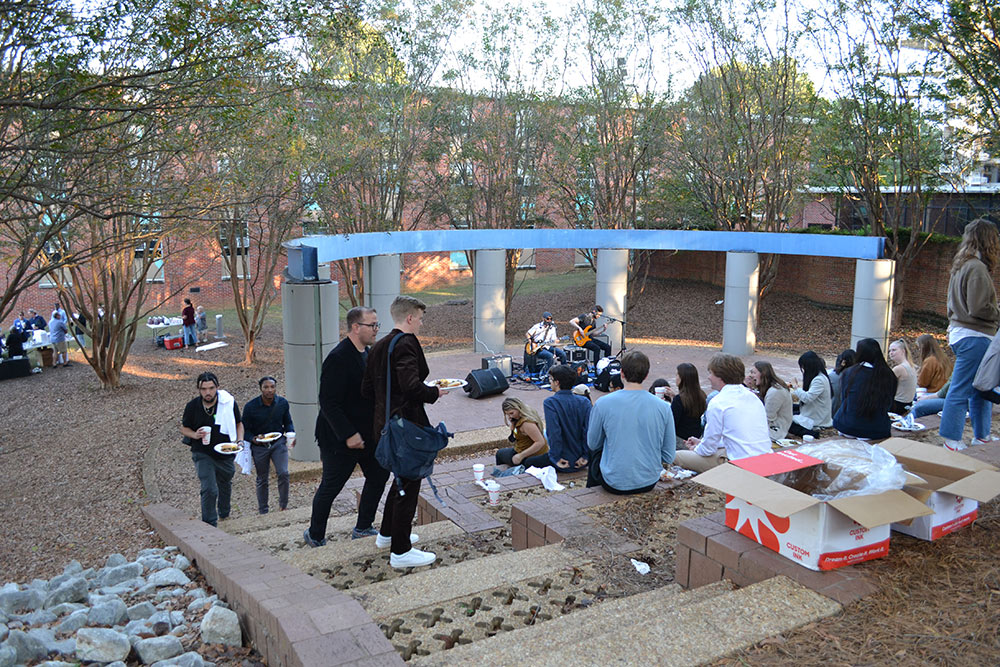 Participants of the Design Leadership Foundation’s Professional Horizons Workshop enjoy live music and barbeque outside of Giles.