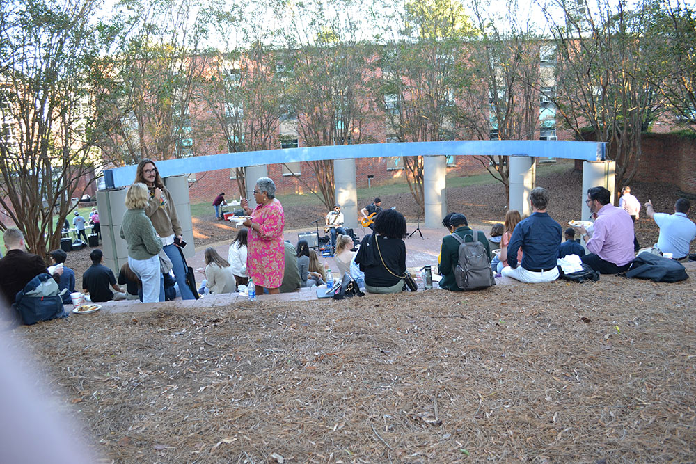 Participants of the Design Leadership Foundation’s Professional Horizons Workshop enjoy live music and barbeque outside of Giles.