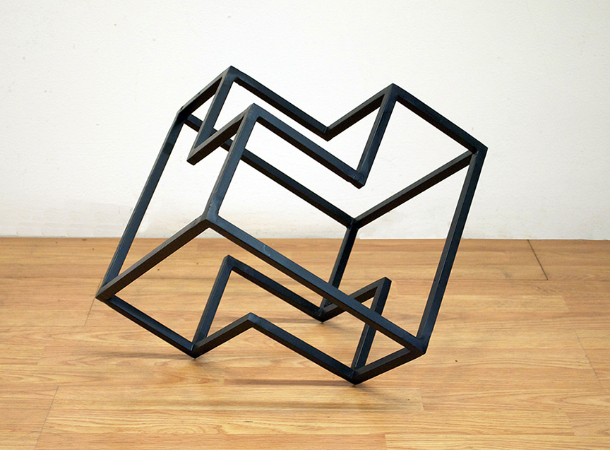 Abstract shape sculpture made from metal rods.