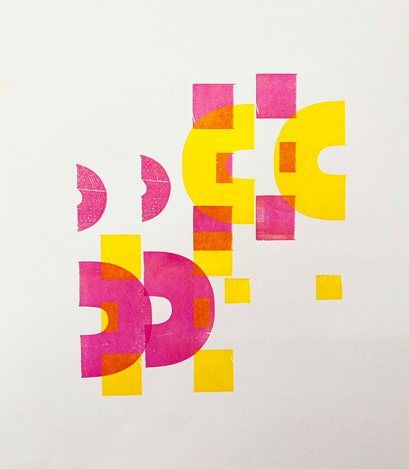 Pink and yellow shapes printed on white paper.