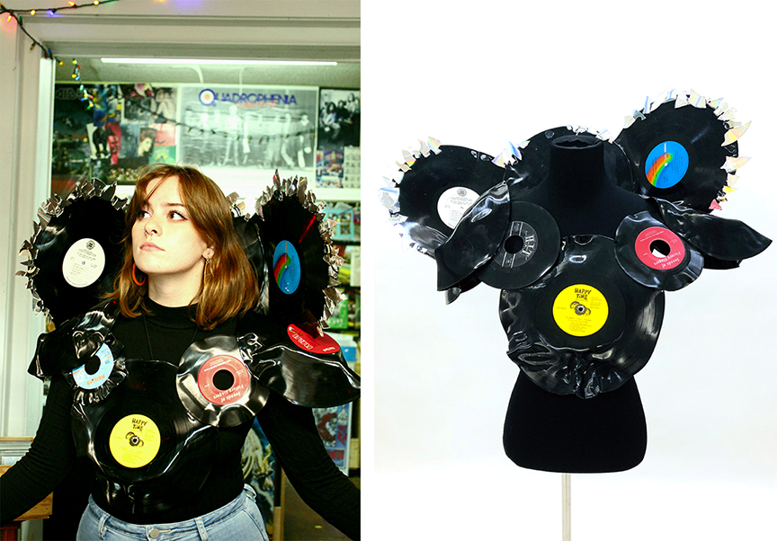 Photograph of a young woman in a record store wearing a top made of melted records