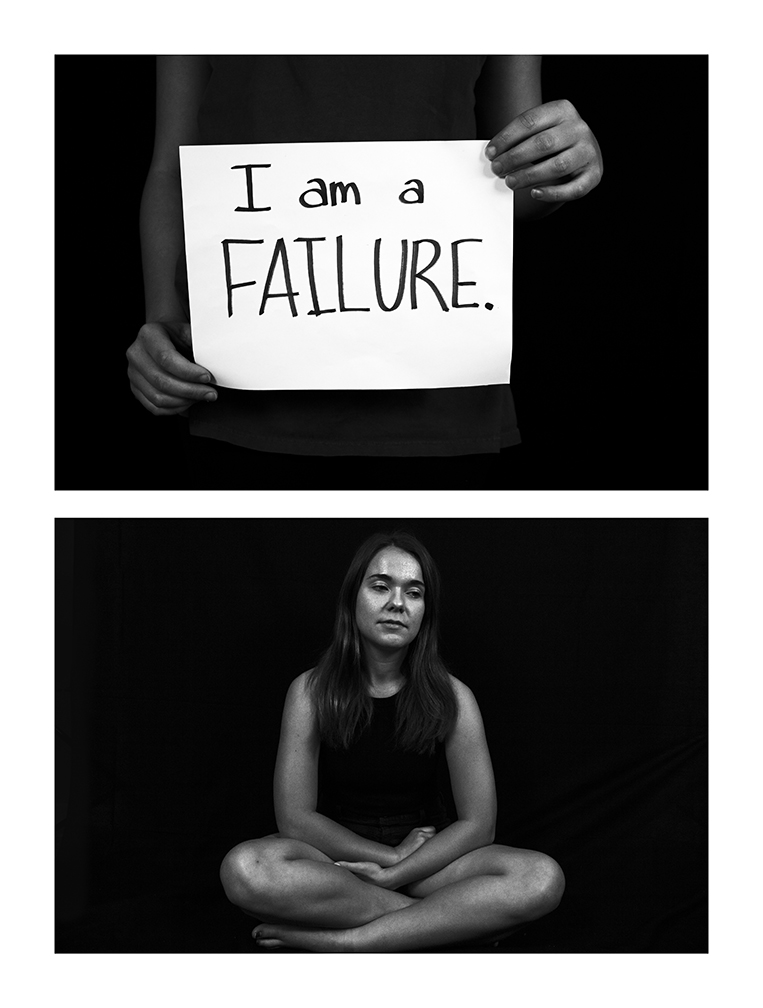 Black and white photograph of a young woman and a handwritten sign that reads &quot;I am a failure.&quot;
