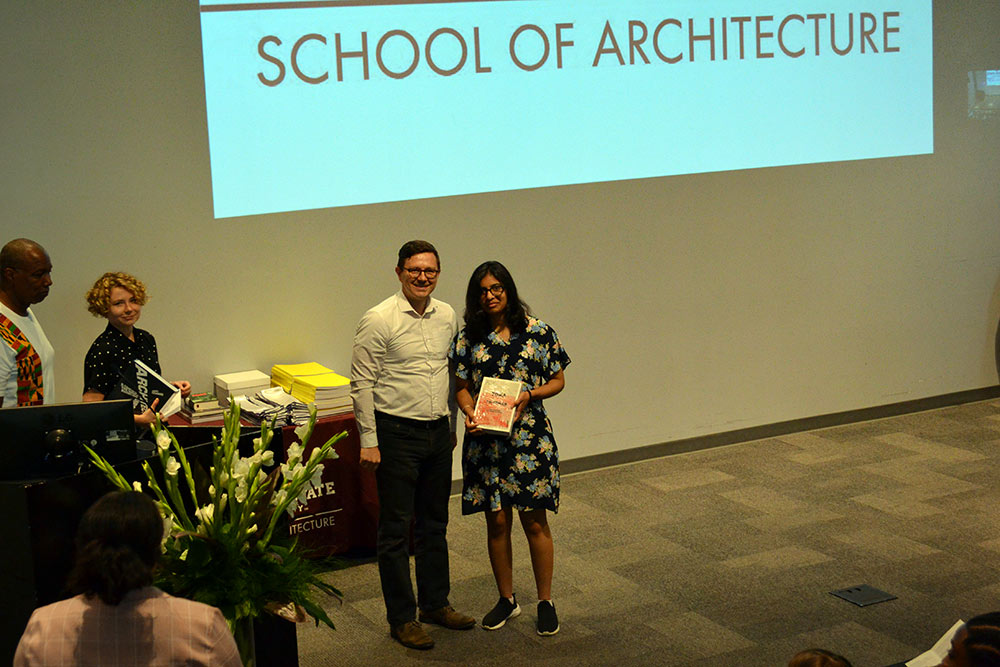 Second-year Faculty book award recipient Sapna Patlolla, left, with Professor John Ross