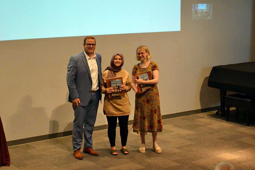 left to right: Professor Jake Gines with Gizem Karsi and Jacquelin Lee, who received the Fourth-Year Faculty Book Award