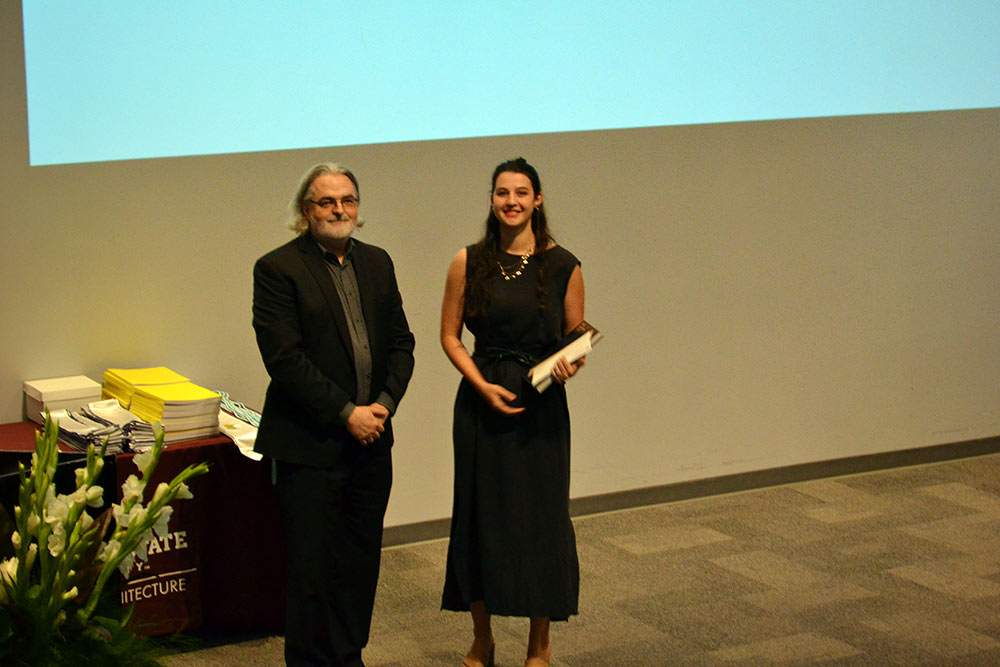Associate Director Jassen Callender presents the Fifth-Year Faculty Book Award to Grace Sheridan