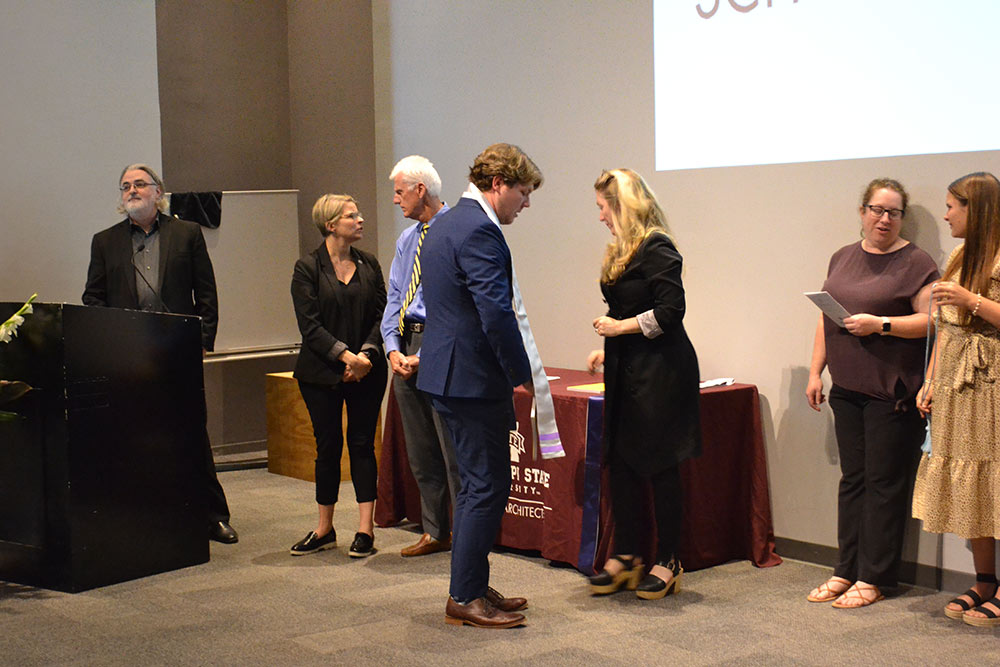 MSU S|ARC class of 2022 students receive their stoles and shake hands with faculty