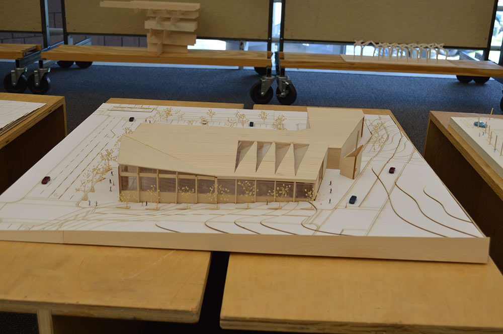A wooden model of a building.