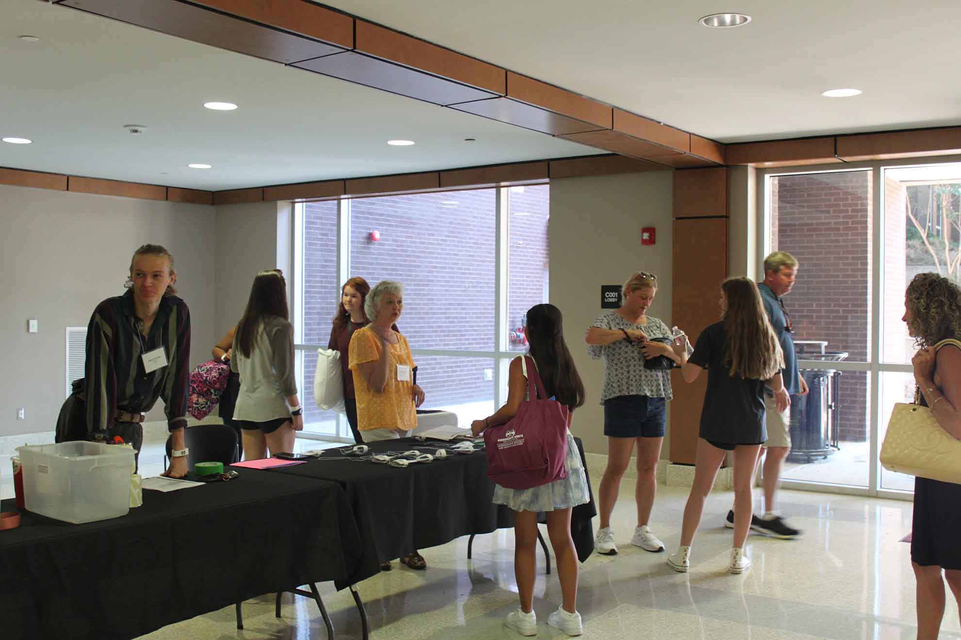 Campers check in at Oak Hall.