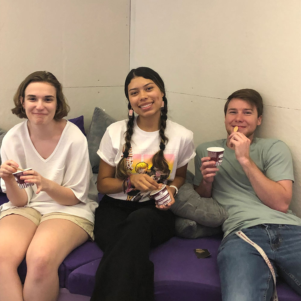 students sit and eat ice cream