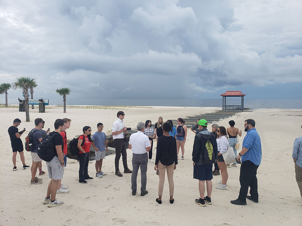 students and faculty with the MSU Coastal Studio gather on a MS Coast beach for reasearch