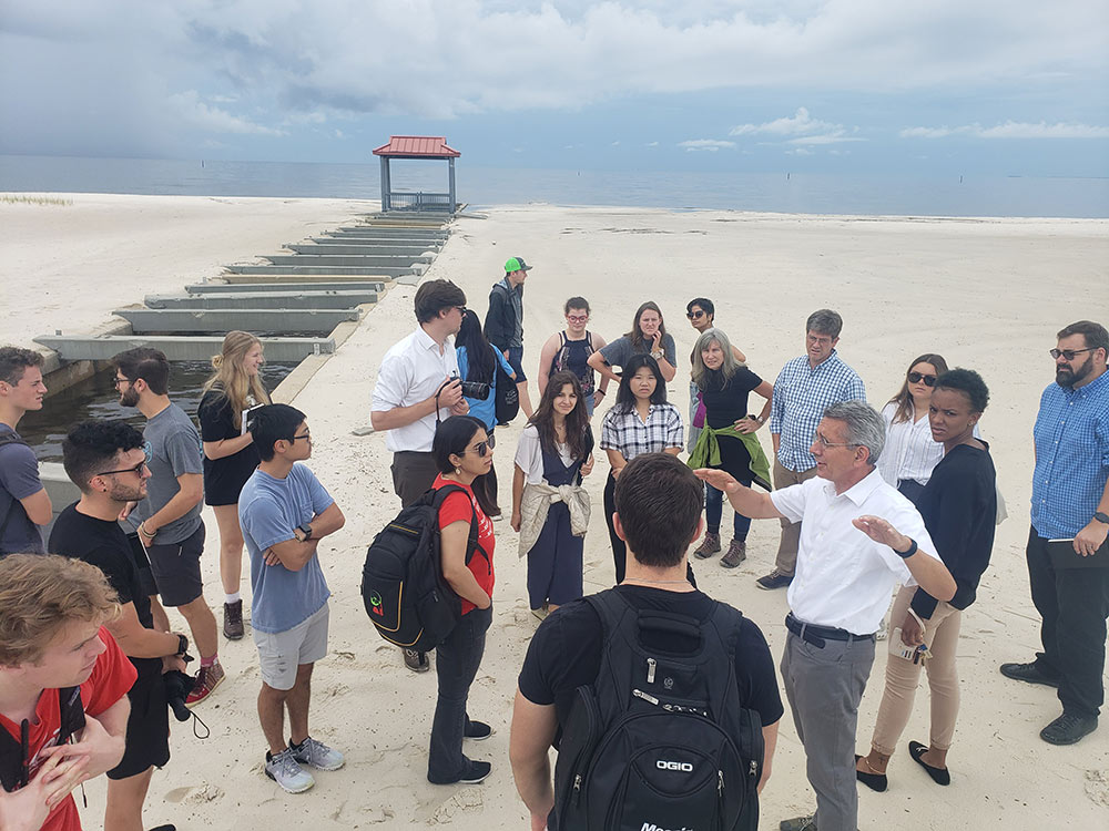students and faculty with the MSU Coastal Studio gather on a MS Coast beach for reasearch