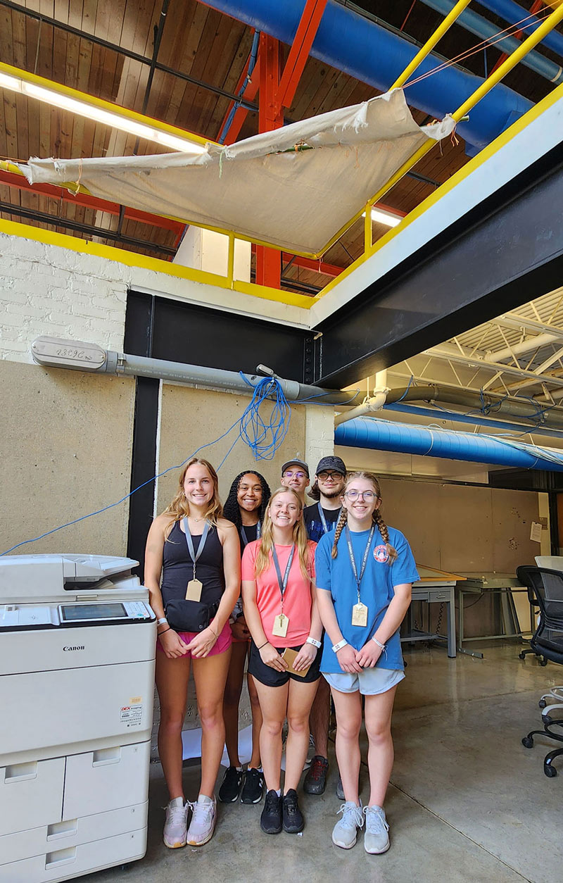Design Discovery campers pose in front of their instant environment project