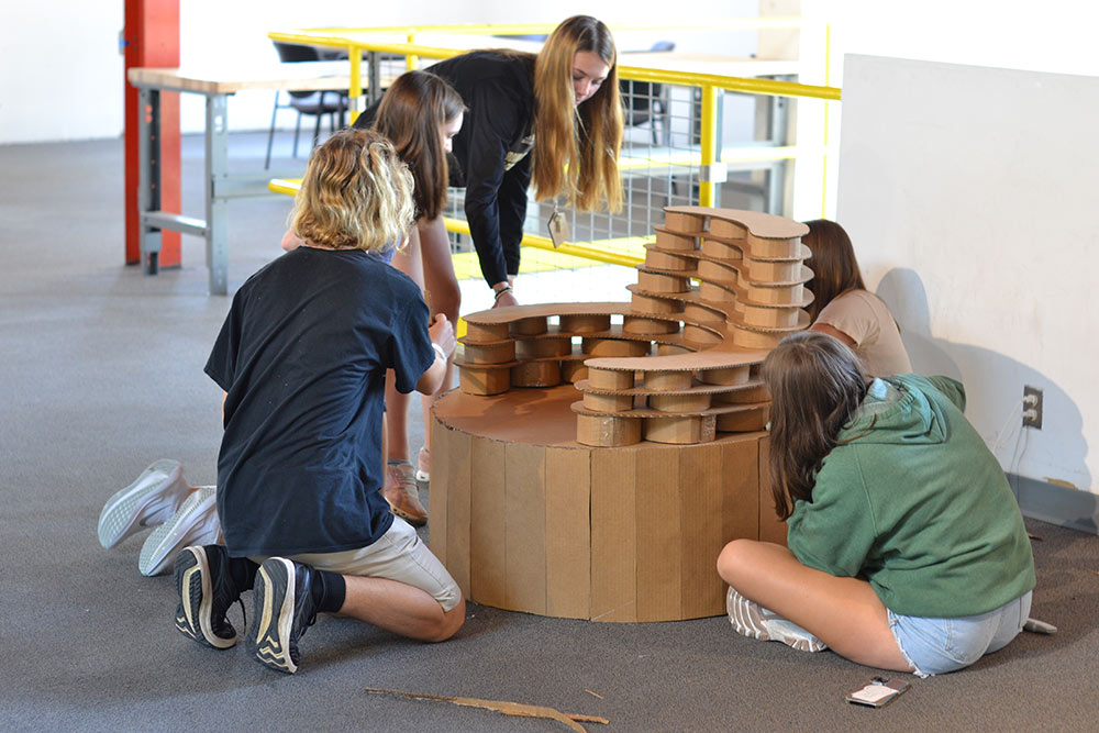 Mississippi State University School of Architecture Design Discovery campers work on their cardboard chair project