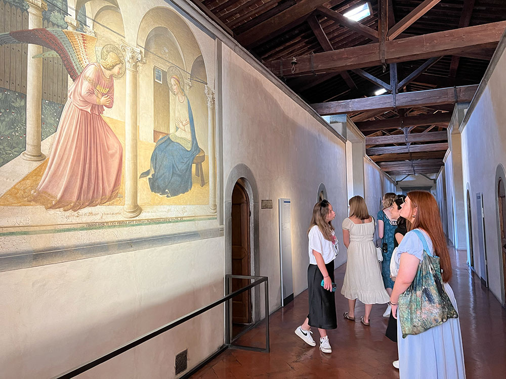 Art student Kinsley Bell admires the early renaissance fresco titled &quot;Annunciation&quot; by Fra Angelico in the Museo Nazionale di San Marco, Florence, Italy.
