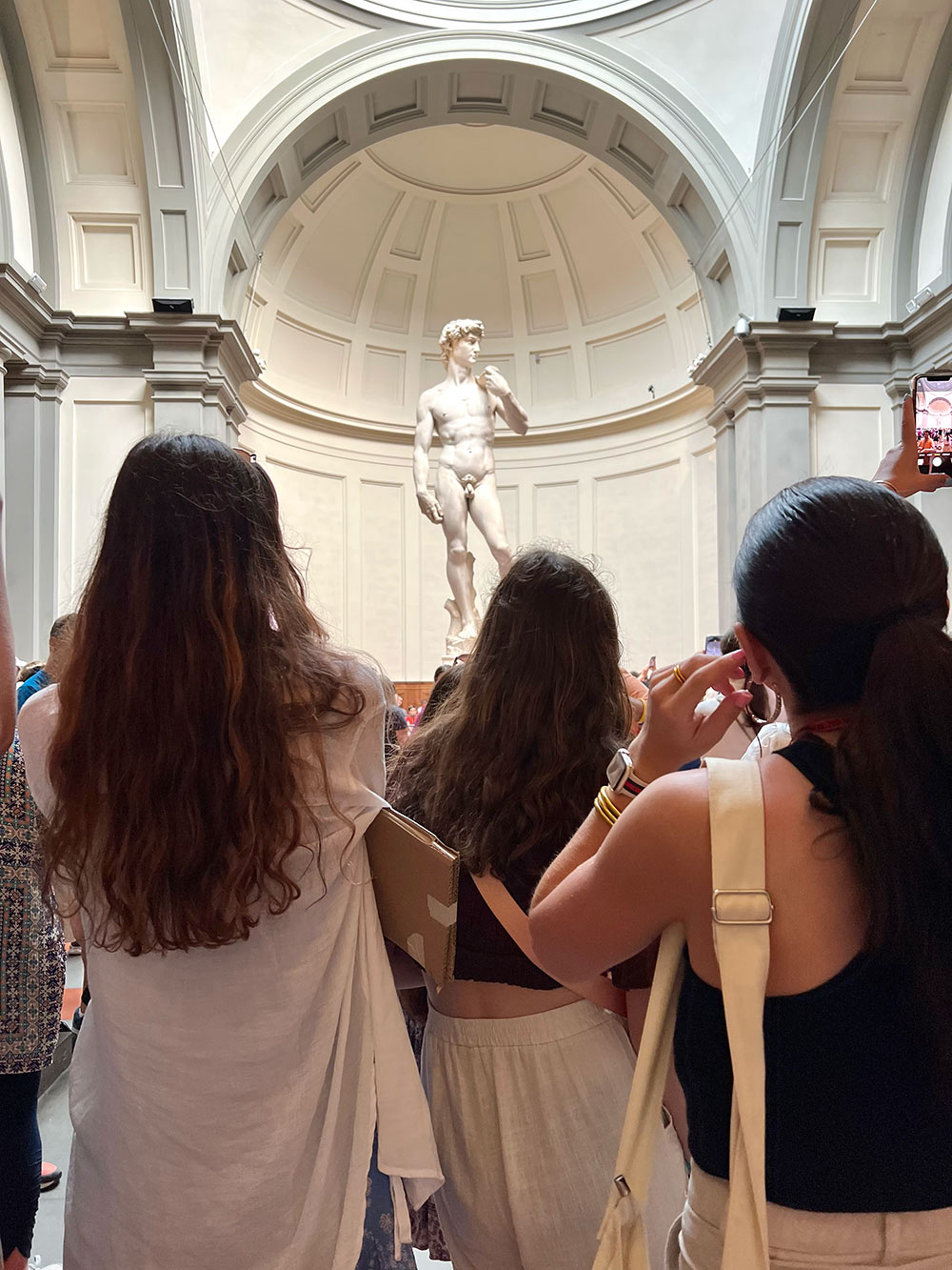 Department of Art students on a guided tour of the Accademia Gallery in Florence, Italy to view Renaissance paintings and sculptures including Michelangelo’s David.