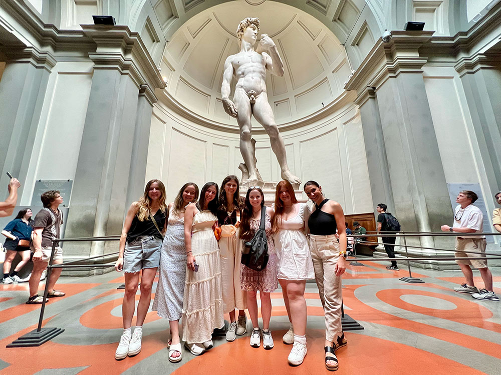 Department of Art students on a guided tour of the Accademia Gallery in Florence, Italy to view Renaissance paintings and sculptures including Michelangelo’s David.