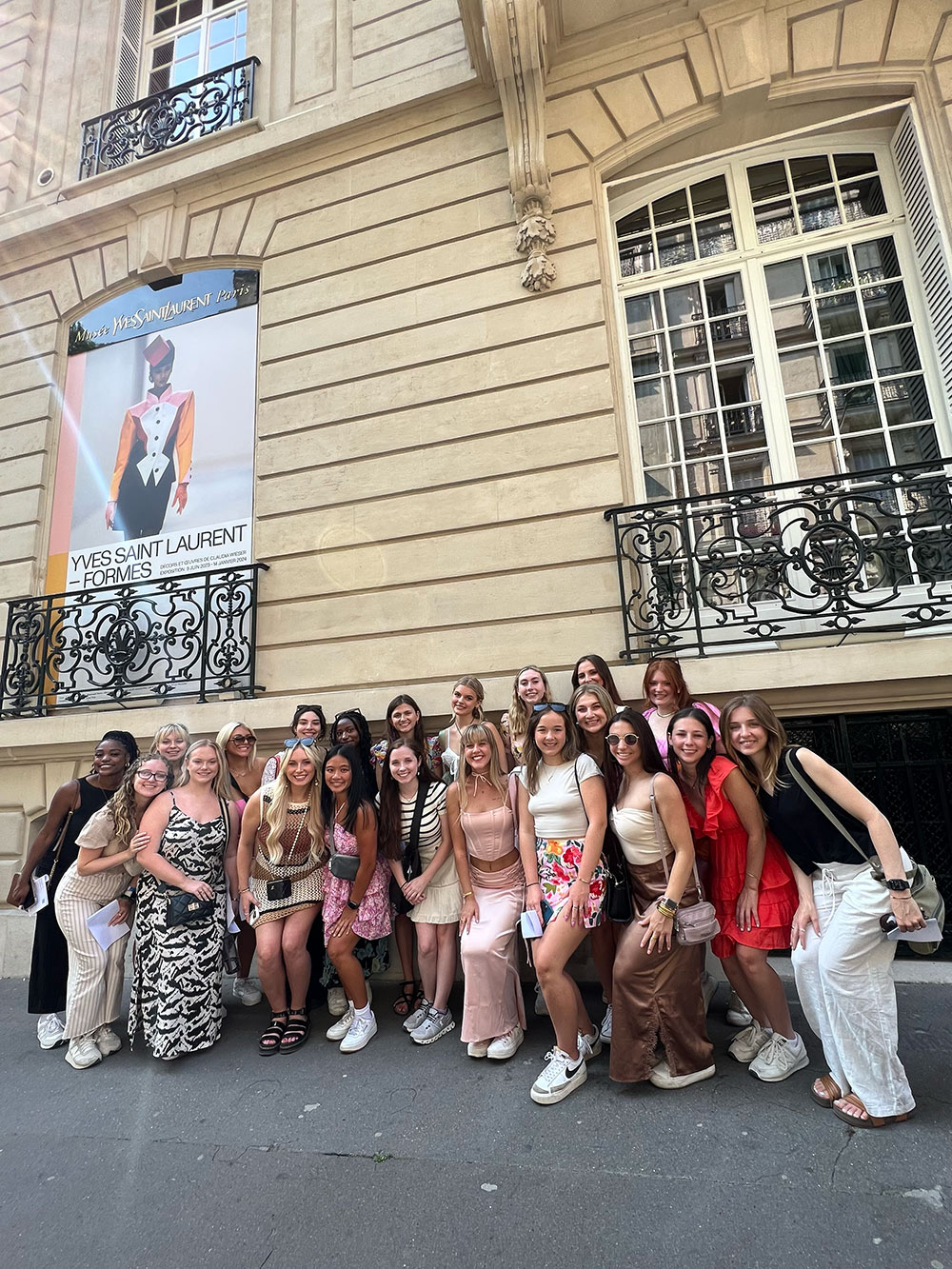  Department of Art and Fashion Design &amp; Merchandising students outside the Musée Yves Saint Laurent in Paris, France. Students viewed the exhibition “Formes” to see the connections between artworks by German artist Claudia Weisner and fashions designed by iconic French designer Yves Saint Laurent.
