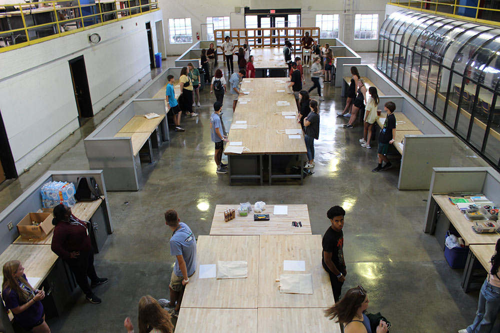 view of full Barn with Design Discovery campers and student counselors standing by desks