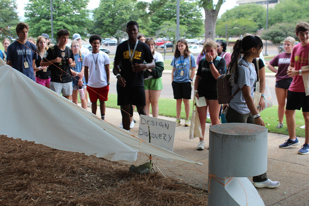 Group of Design Discovery campers observing an instant environment project.