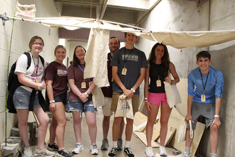 Group of Design Discovery campers posing under their instant environment project.