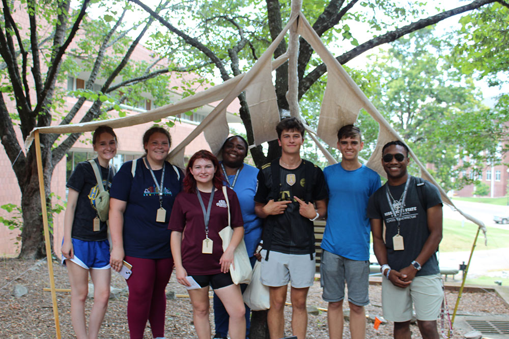 Group of Design Discovery campers posing by their instant environment project.