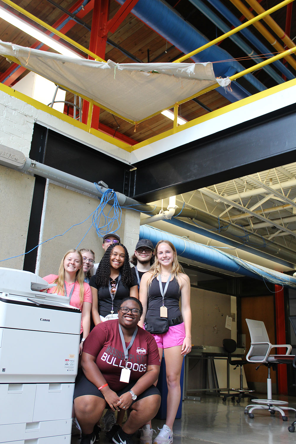 Group of Design Discovery campers posing under their instant environment project.