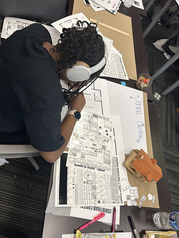 a student planning a house design