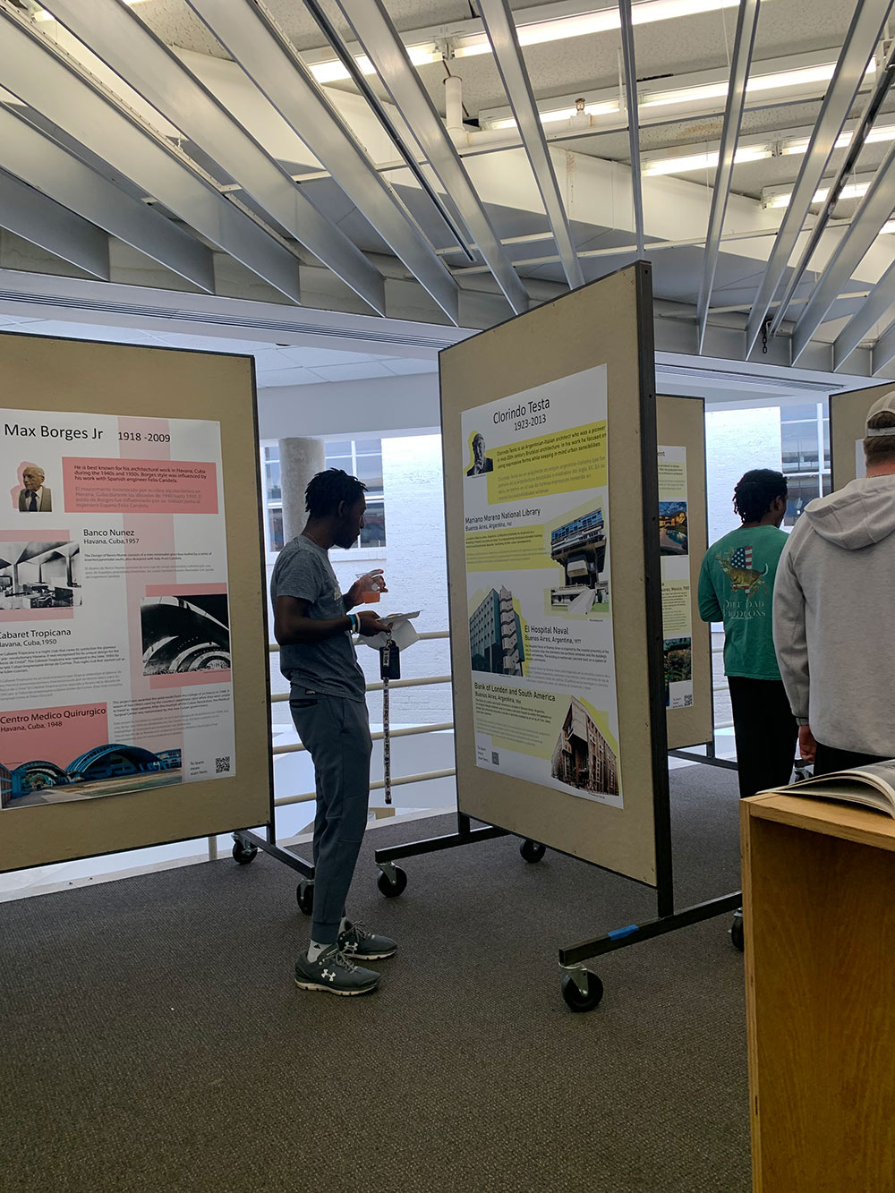 View of a student looking at the showcased exhibit.