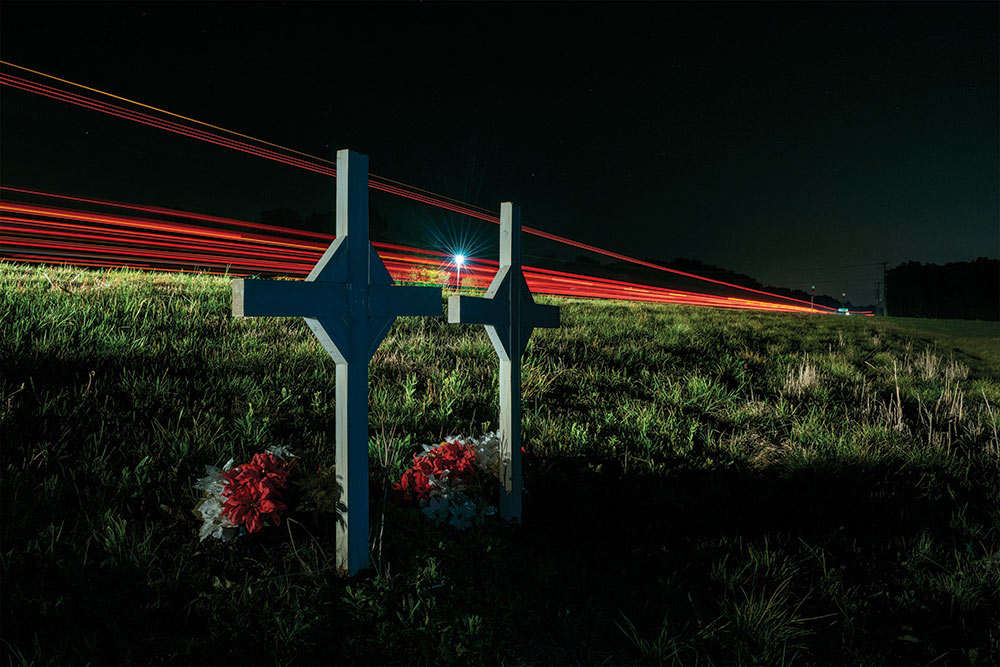 2 crosses in a field at night