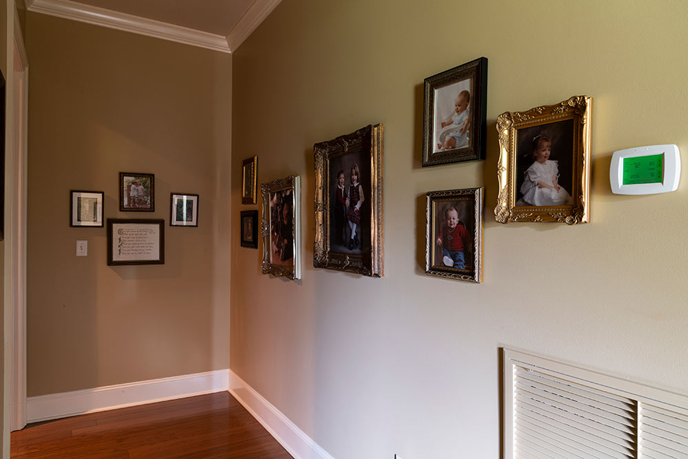 hallway showing framed photos
