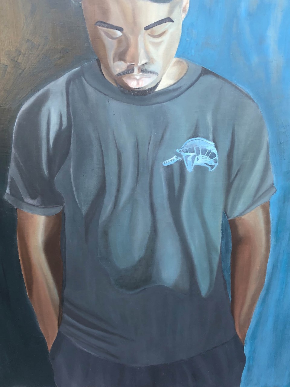 African American male friend emphasizing an emotion of calmness. Detailed and textural image of specific brush stroke and paint layering of blues and blacks on the male figure’s shirt. 