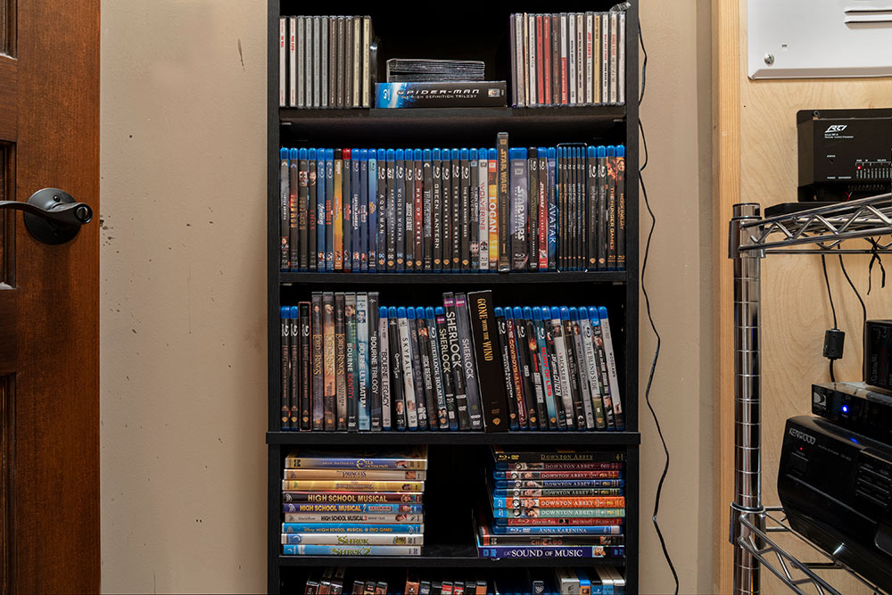 shelf filled with dvds
