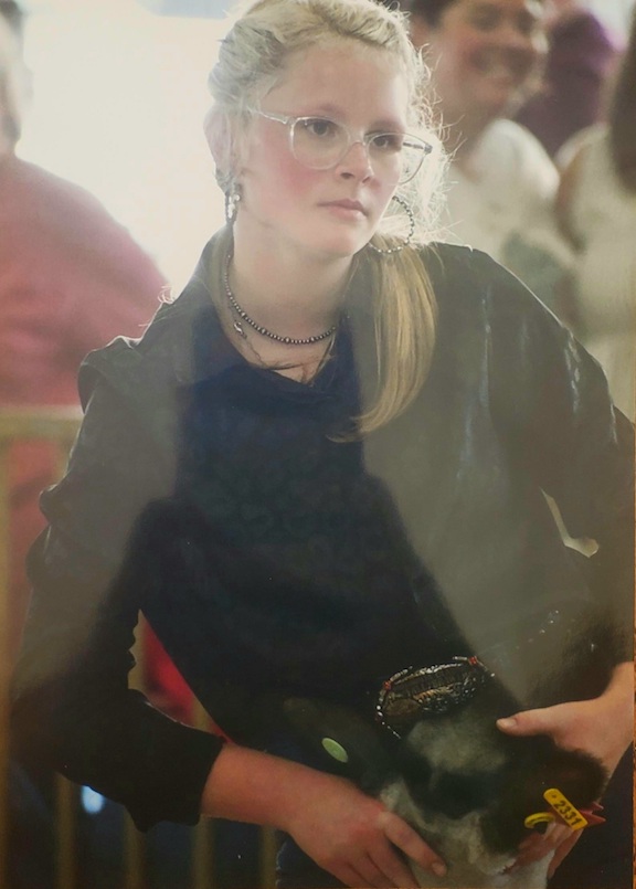 Picture of girl with big belt buckle and glasses